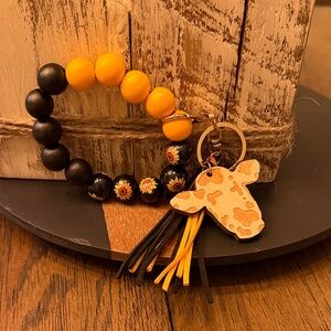 Yellow and Black Beaded Keychain with Cow Charm